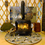 This Marin County yurt has a wood stove with a hearth. Ch...